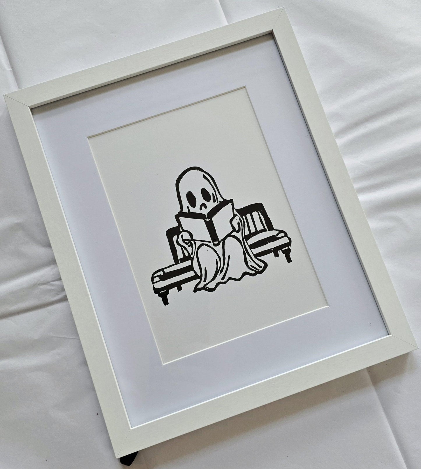 SadCuteGhost | Original | Linoprint |  reading on a bench